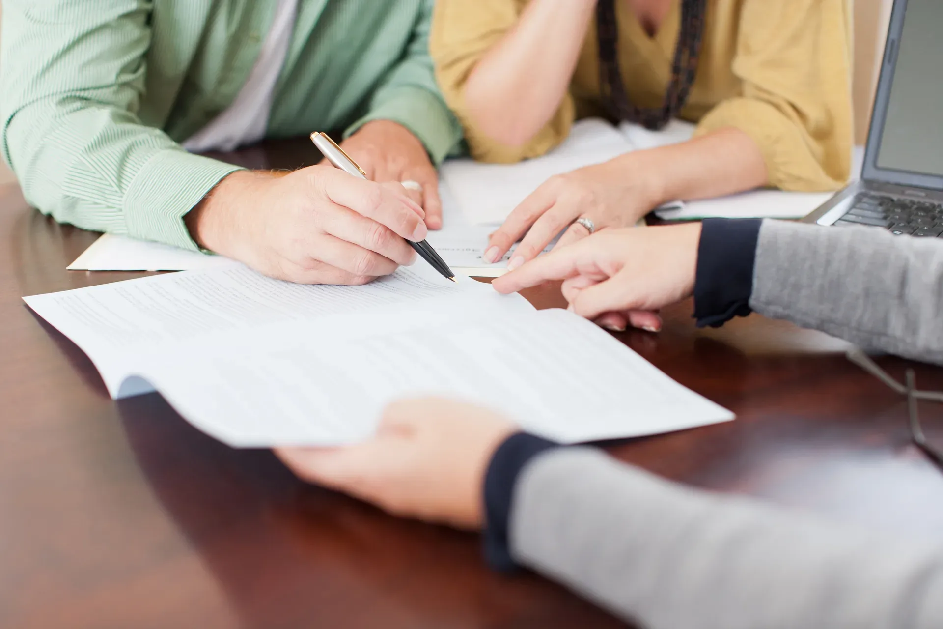 A buyer signing a representation agreement with their agent