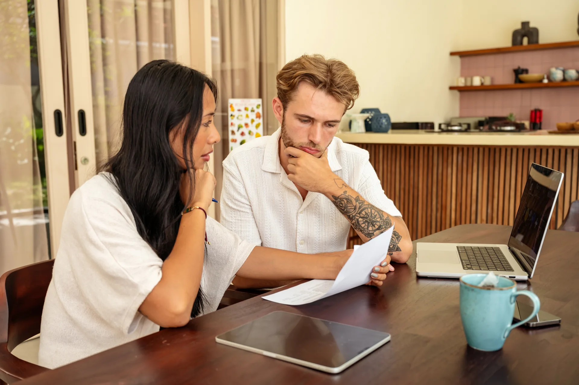 A couple reviewing property documents closely — the moment a data error stops being theoretical