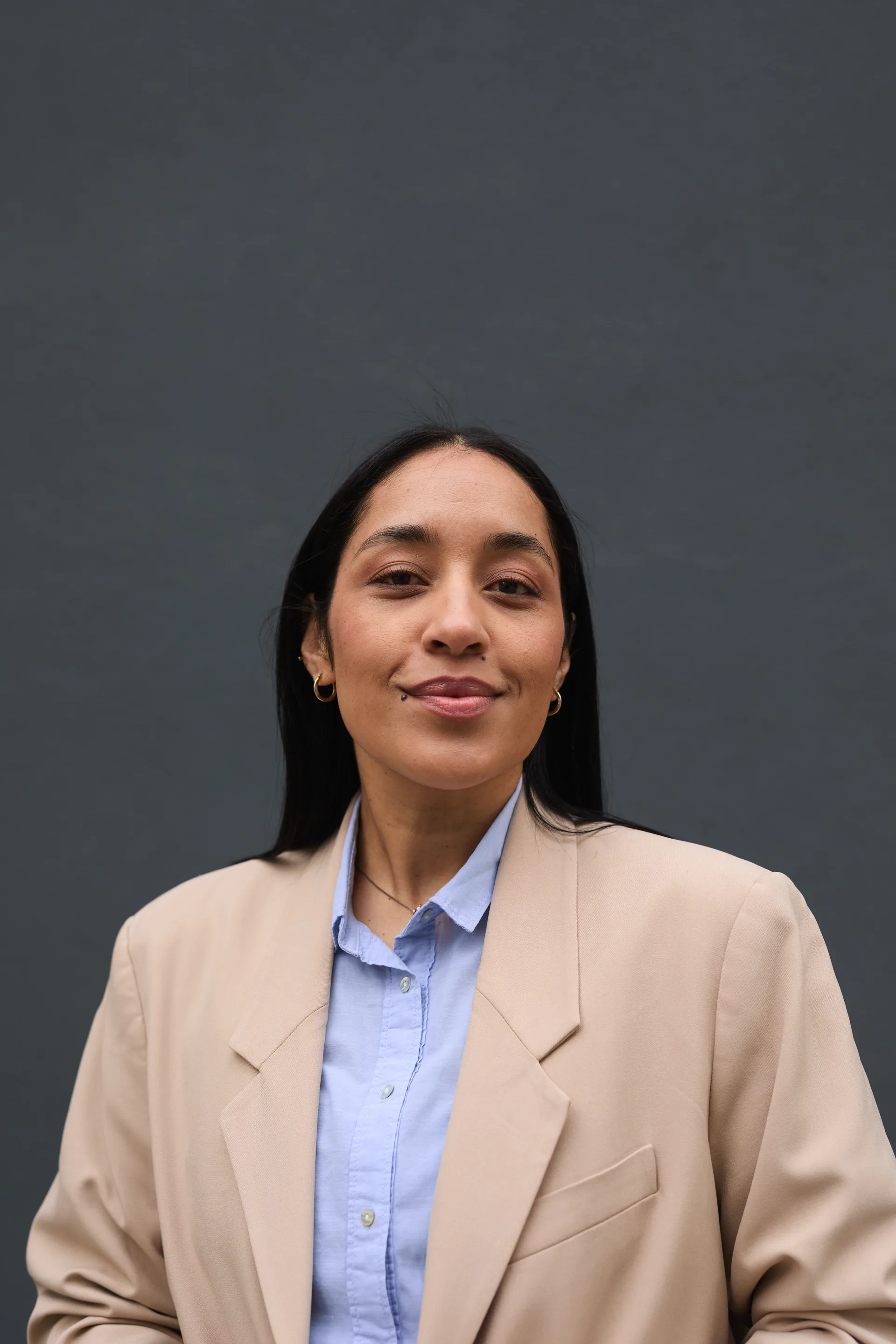 A professional headshot of the kind used on an agent profile page