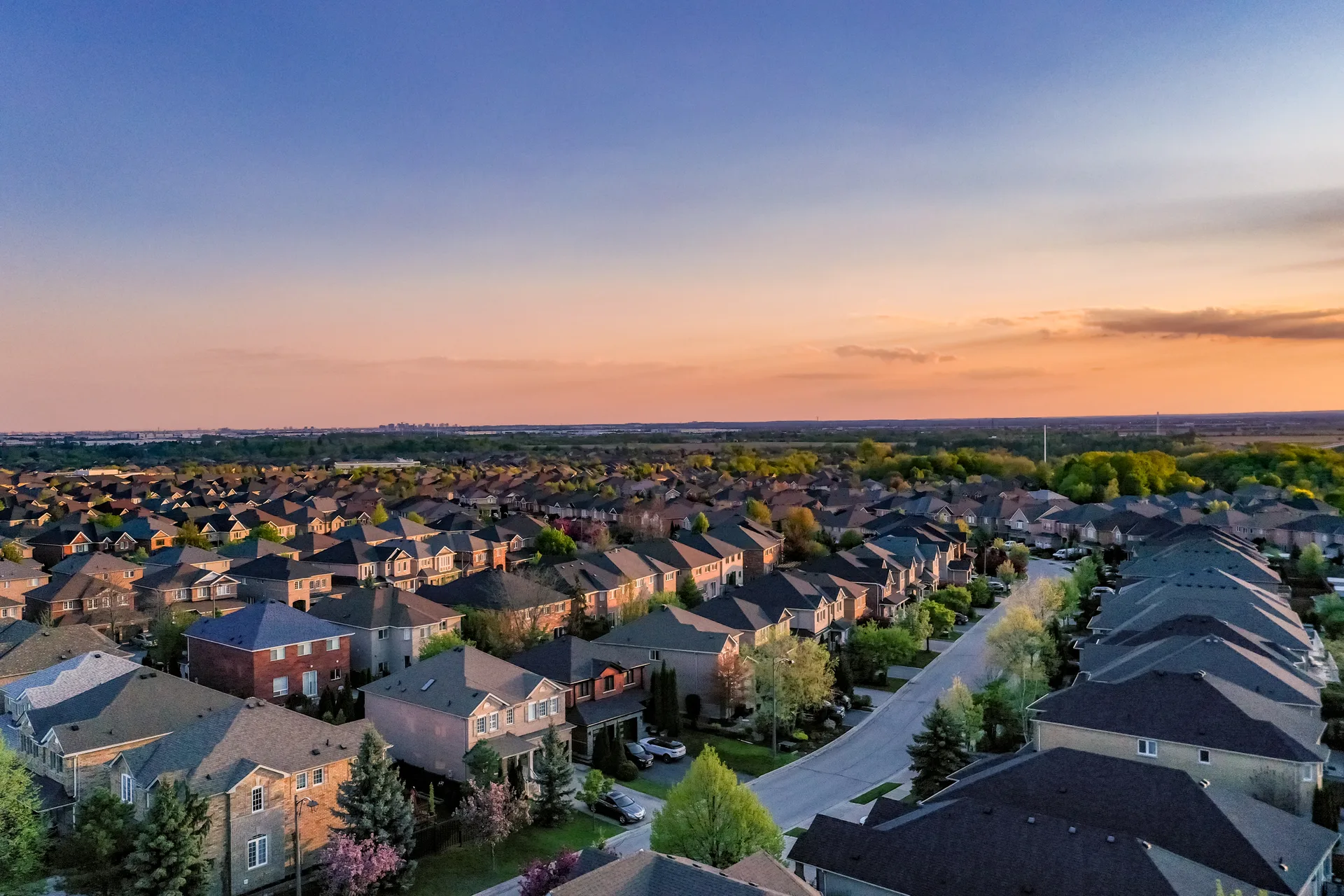 Aerial view over a Woodbridge residential district in Vaughan — the detached fabric priced against the million-dollar line