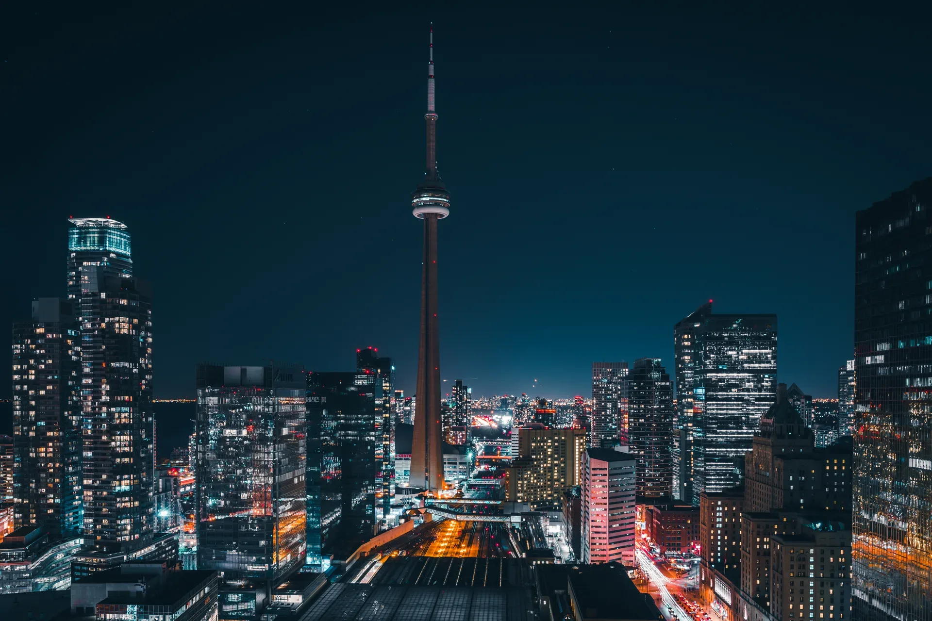 Toronto skyline at night — the TRREB market whose sold data a VOW website unlocks for registered visitors