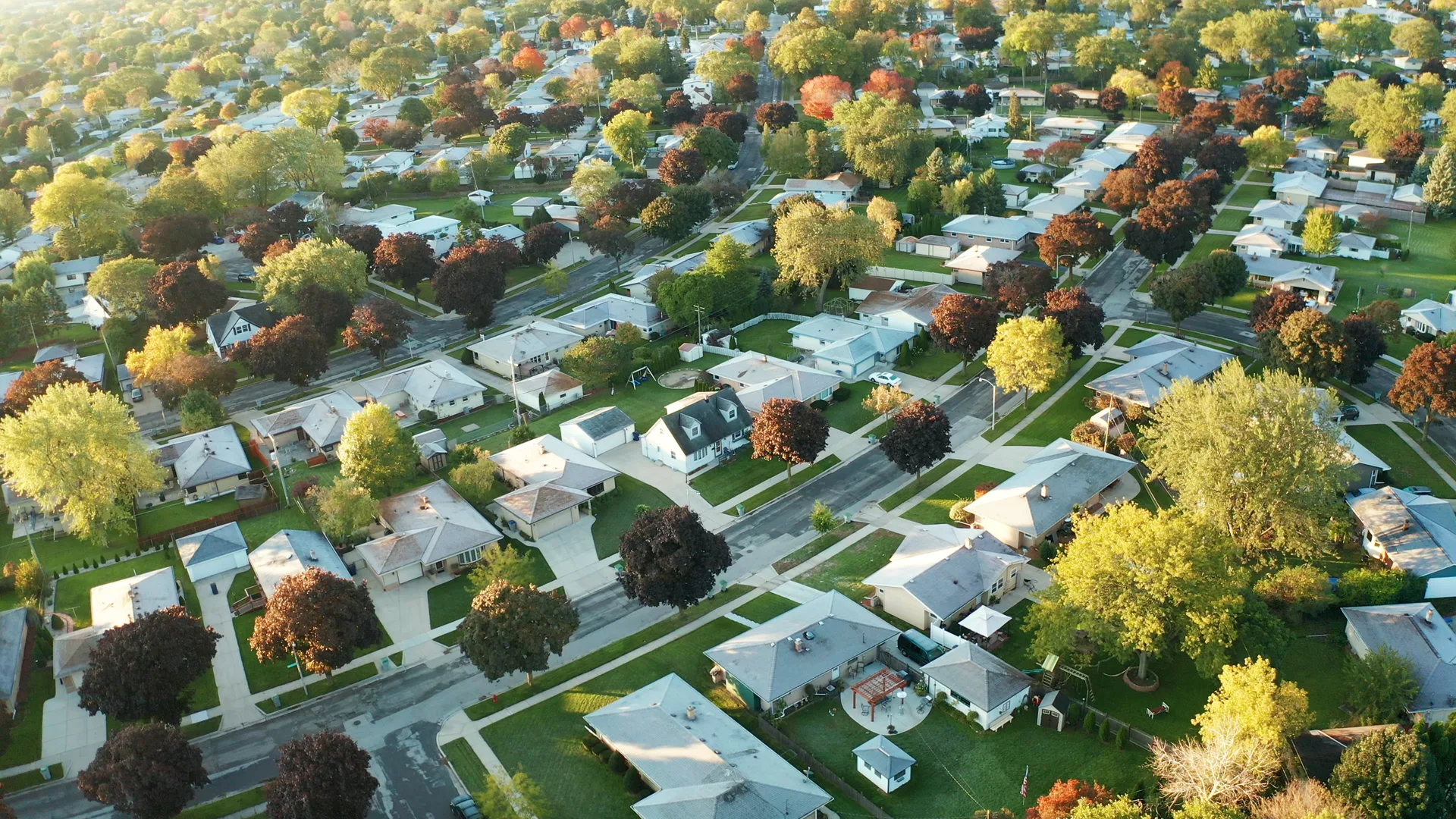 An aerial view of a residential neighbourhood in autumn — board territories are ultimately maps