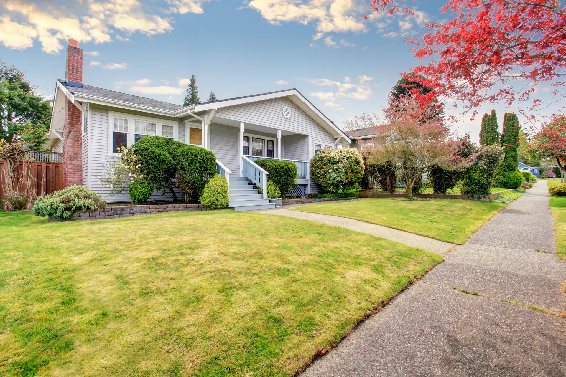 A modest detached house with a covered porch, the residential stock that sits a few blocks off any tourist strip