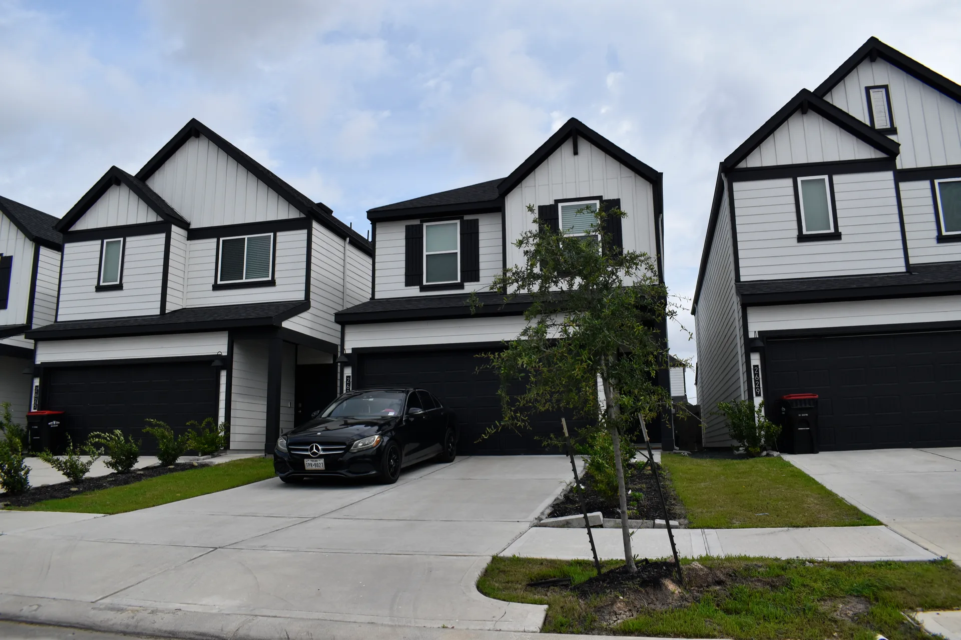 A new subdivision street of family homes, the growth-town stock rising along the Highway 400 corridor
