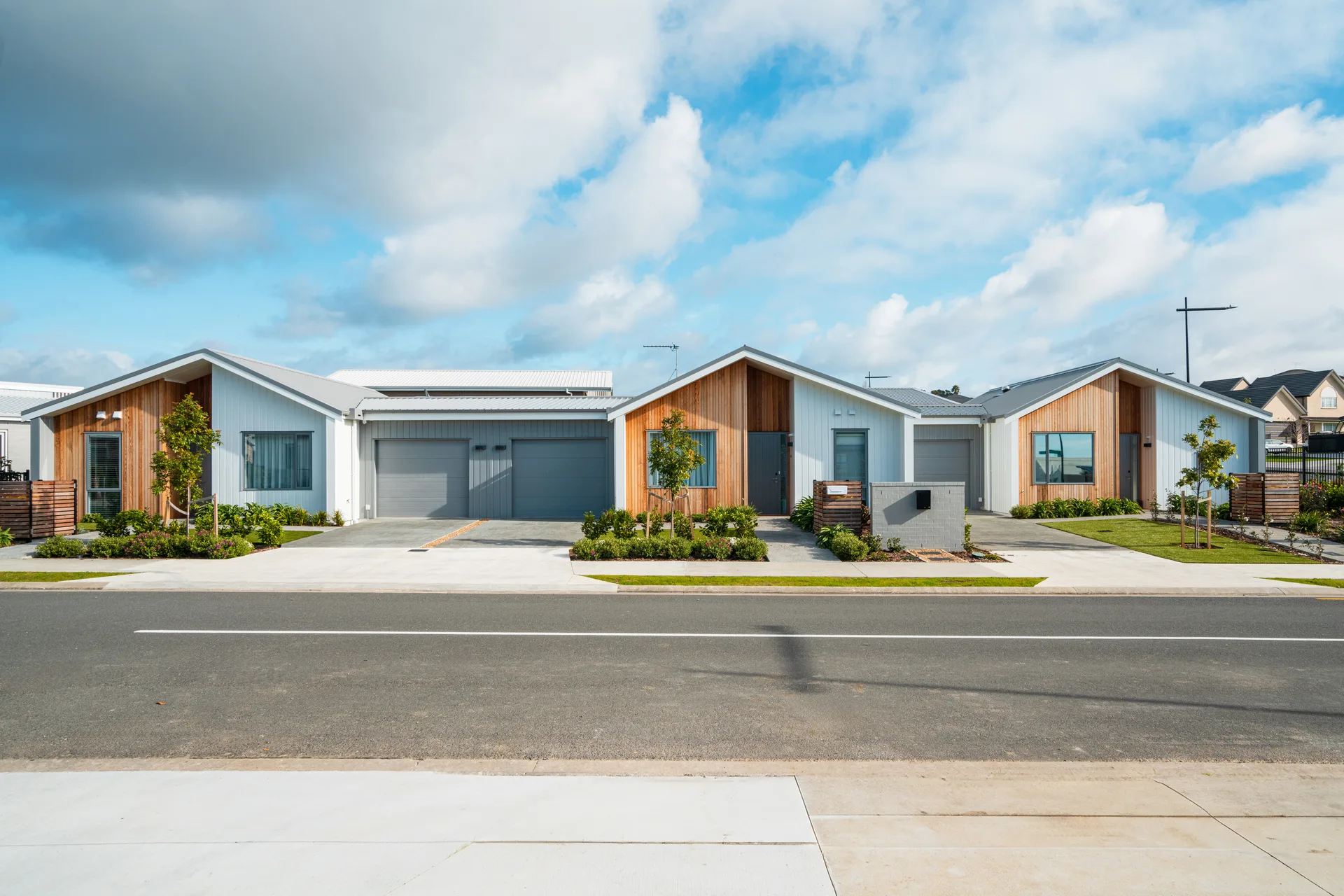 A row of tidy rental homes on a residential street — the investor stock a university-adjacent market runs on