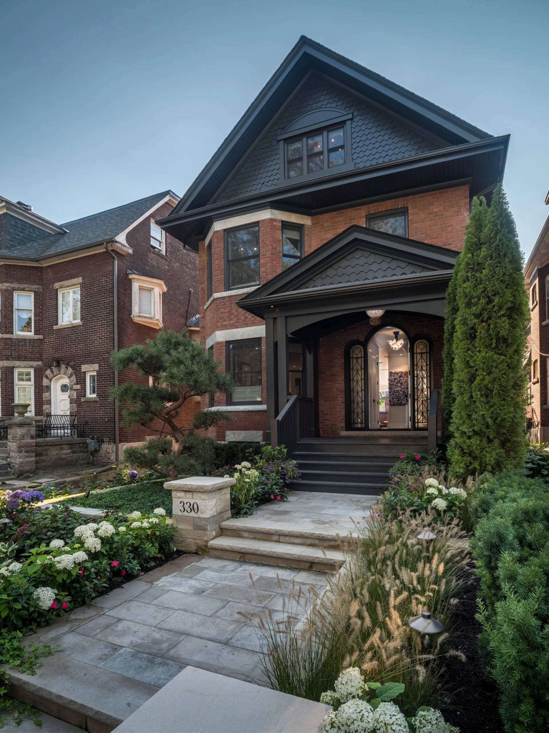 A home photographed at dusk — the calibre of hero image a listing marketing page should lead with