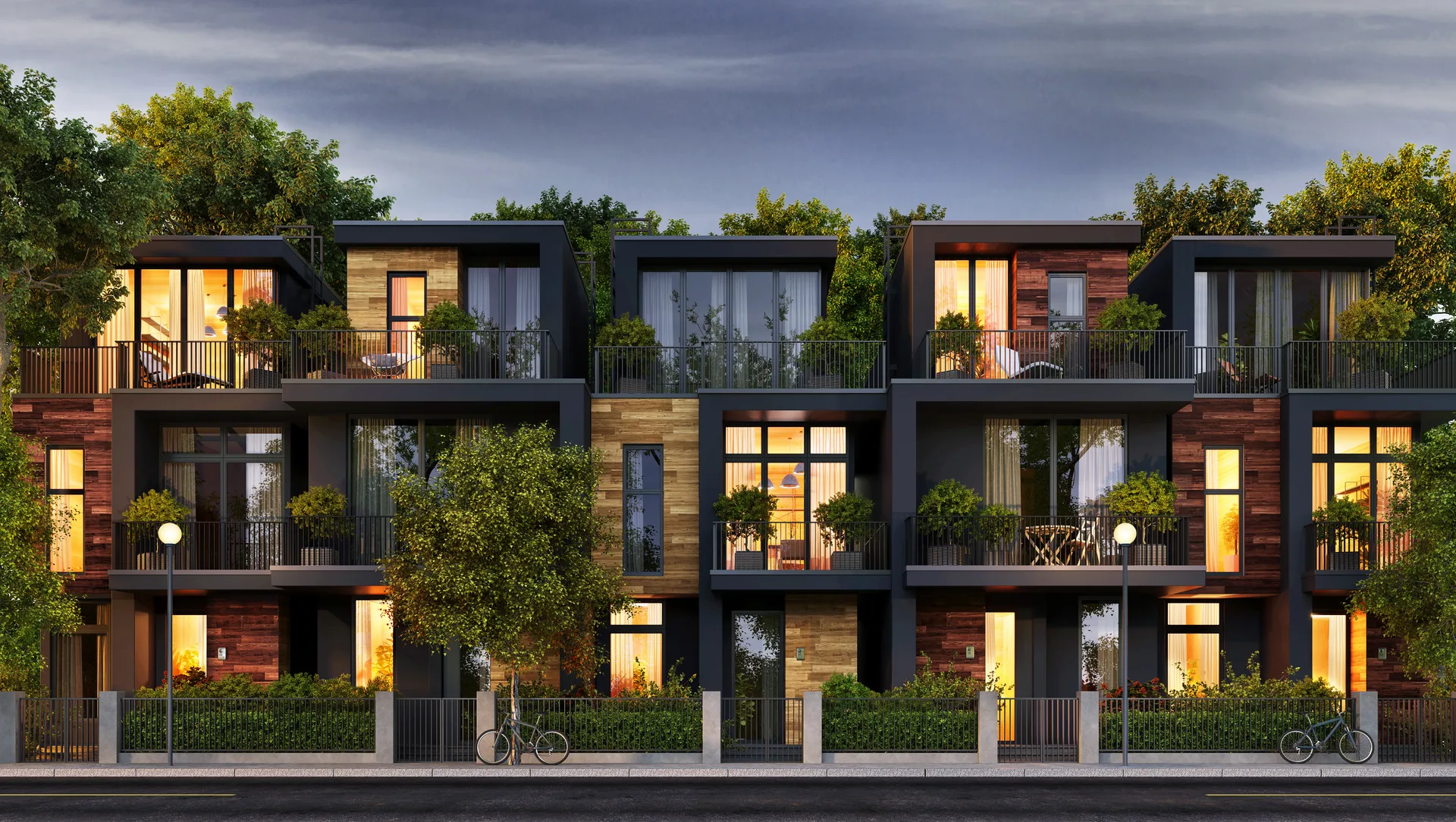 A row of modern townhomes at dusk — the product a fast-growing suburban market trades in
