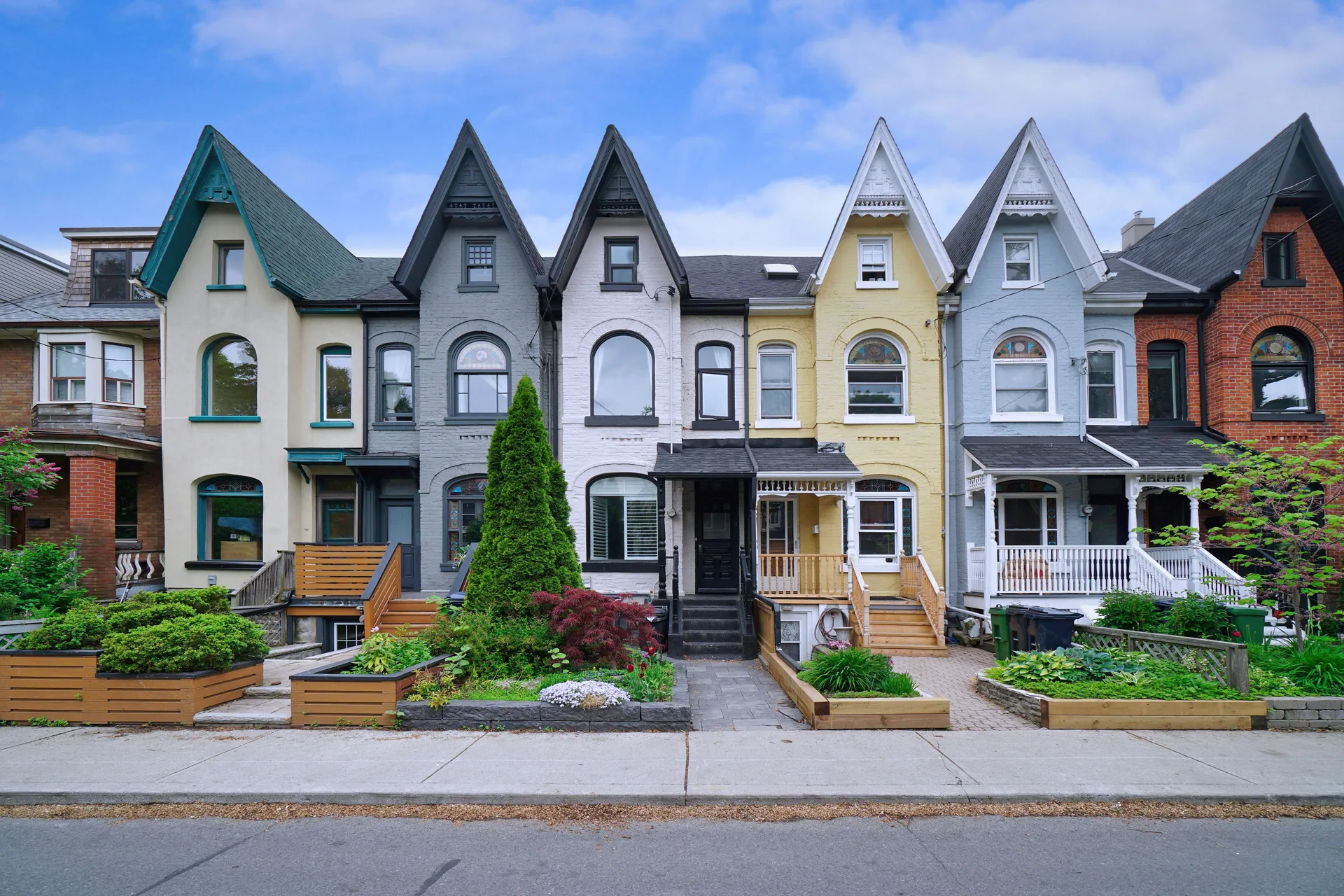 A row of similar Victorian houses — shared structure, distinct addresses