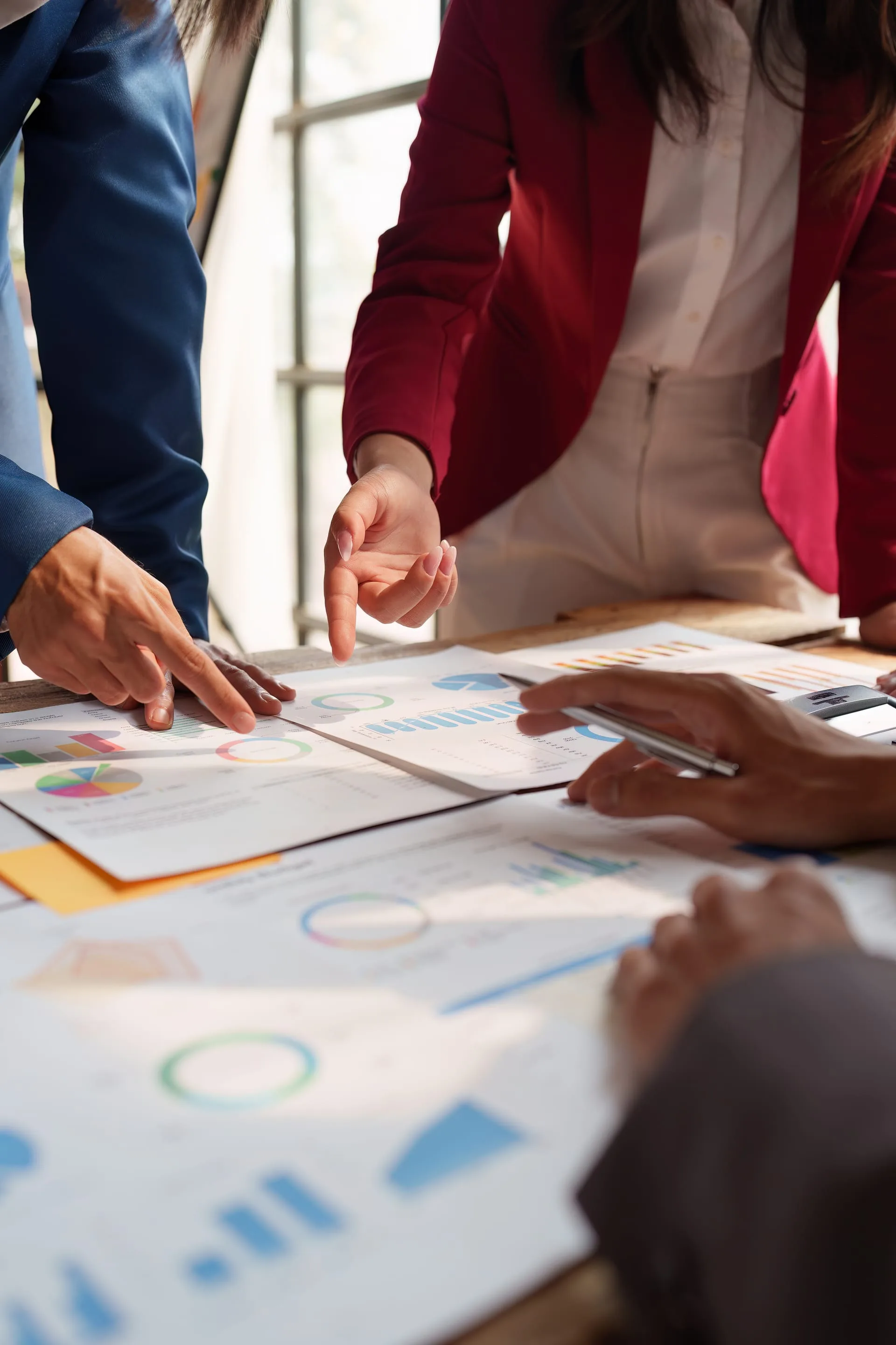 Agents reviewing pipeline numbers together — lead generation is a system you operate, not a package you order