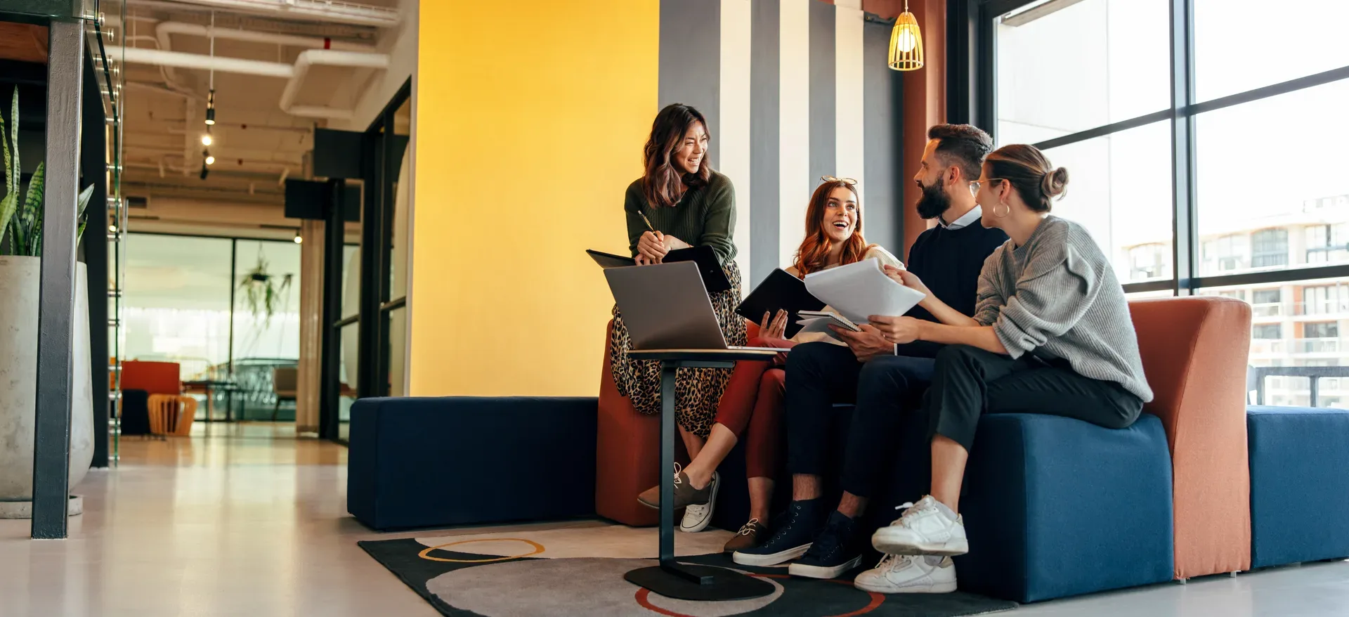 Agents and staff meeting in a brokerage office lobby