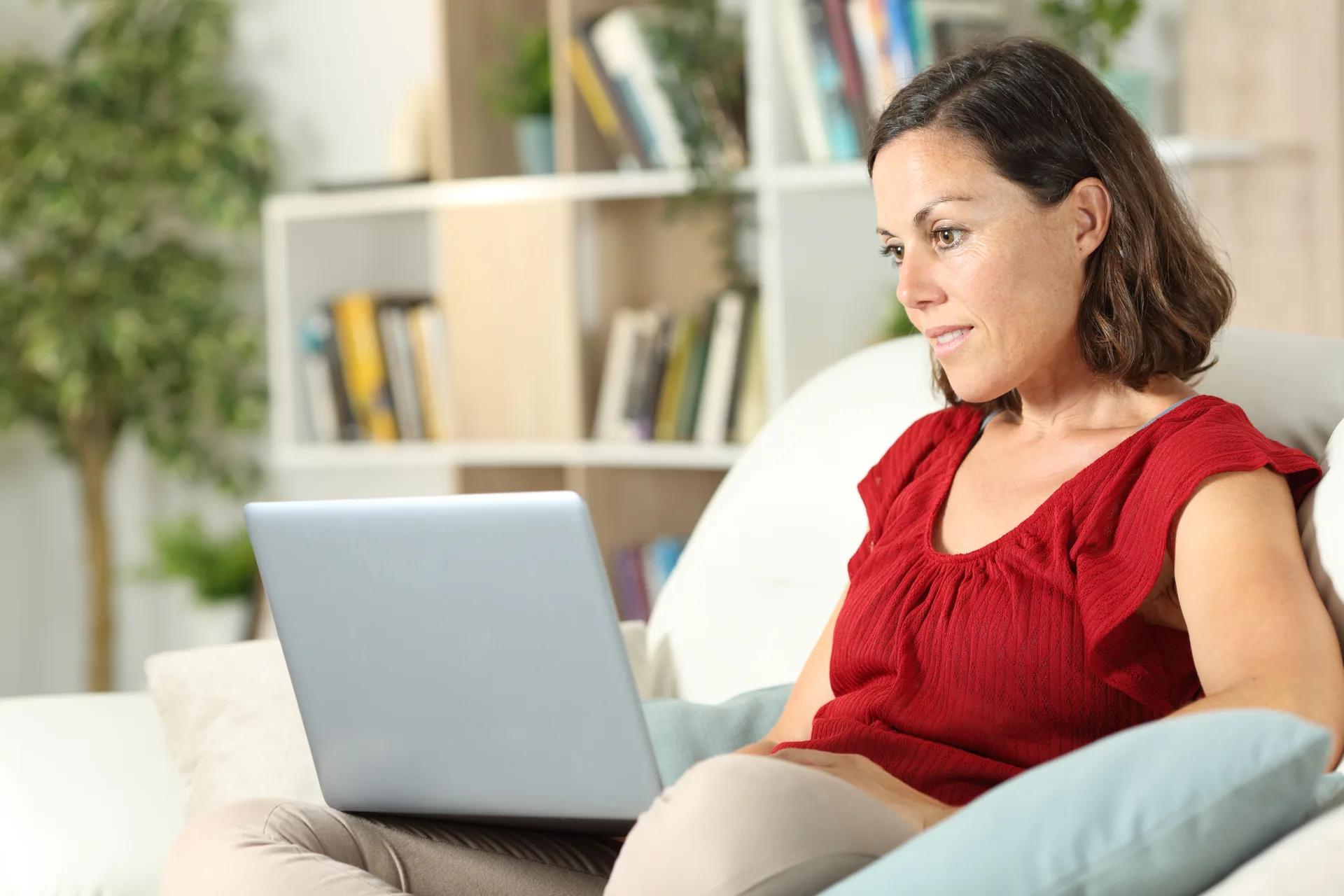 An agent working leads and site updates from a single laptop session