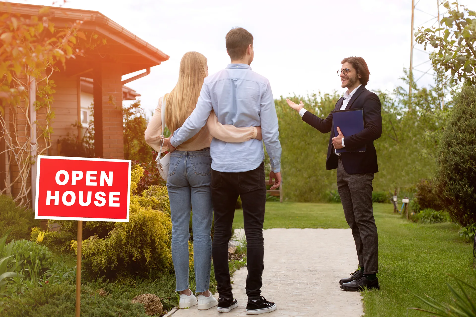 A couple touring a home for sale — buyer leads are people mid-search, not names on a list