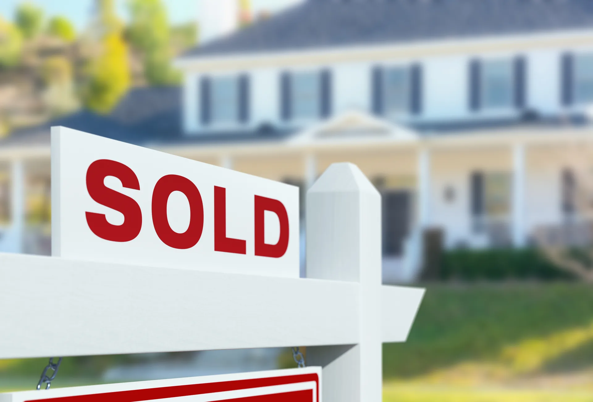 A sold sign in close-up — the price behind it travels through a gated feed class, not the national pool