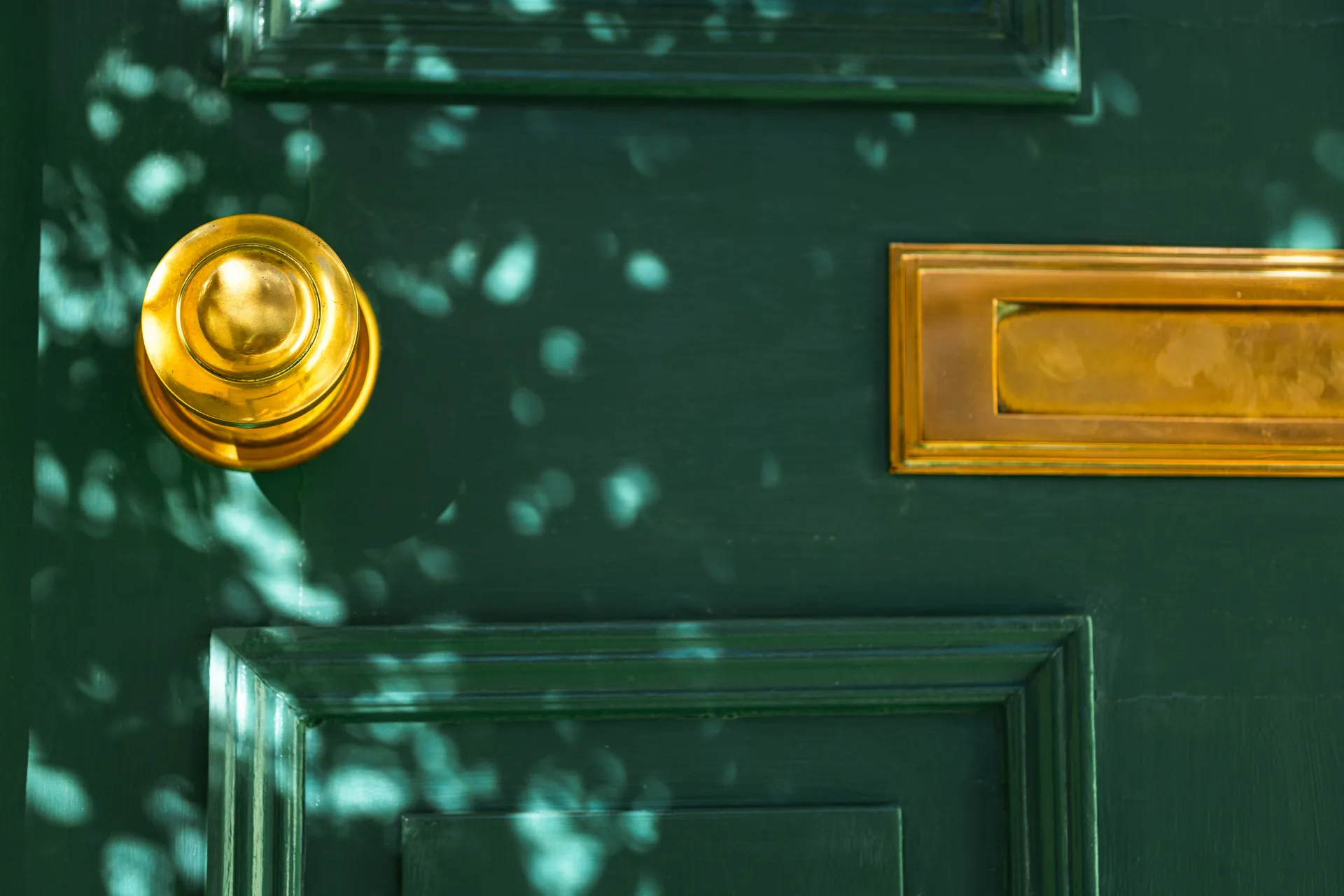Brass doorknob in close-up — ownership of a website comes down to who holds which keys